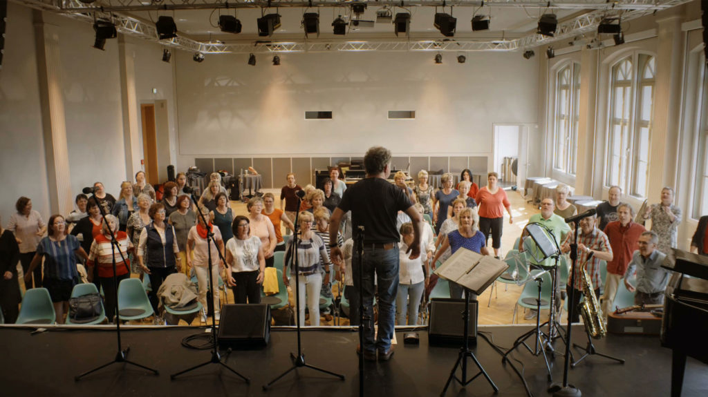 Group of people learning a song