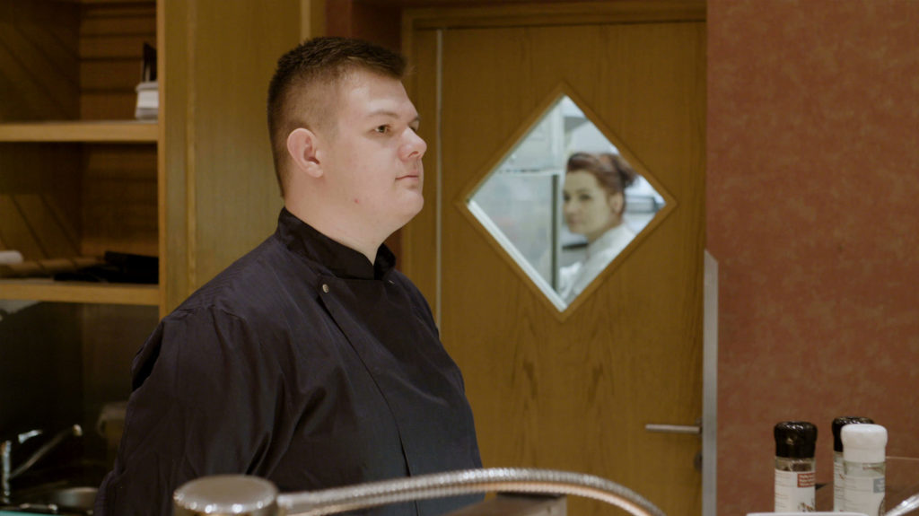 Young Man working in a Restaurant