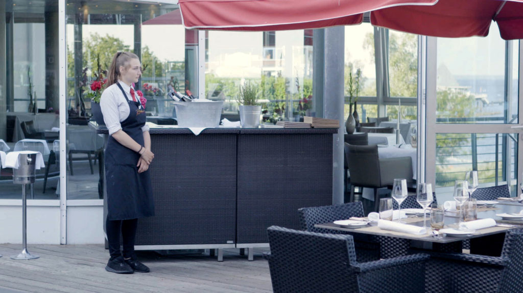 Young Woman working in a Terrace Restaurant