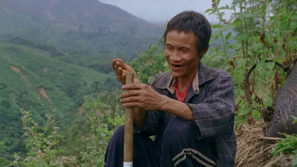 Man smiling in the hills of Vietnam